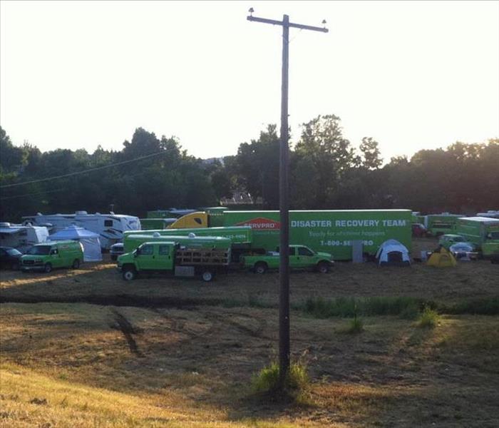 SERVPRO vehicles parked on site.