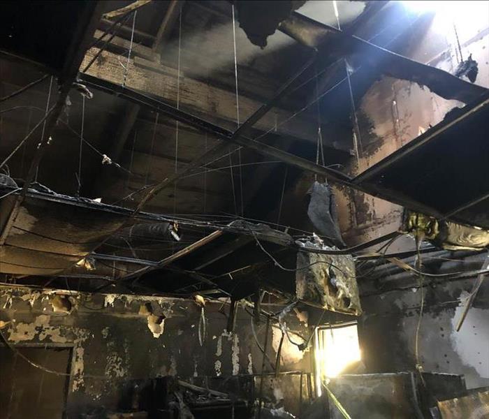 Severe fire damage inside home.